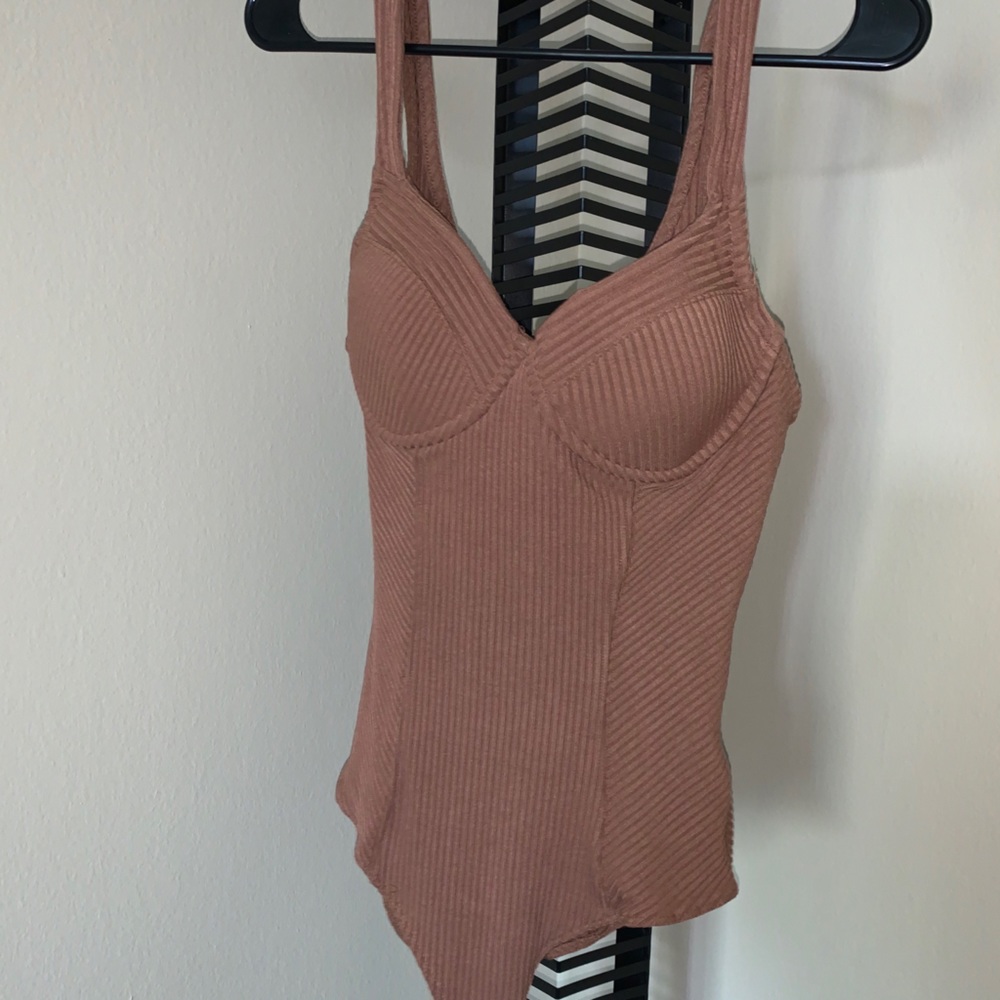 NEW Bodysuit with a tag attached